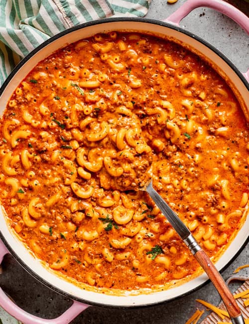 overhead photo of a pink pot of cheesy hamburger helper
