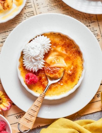 overhead photo of a white ramekin with vanilla creme brulee