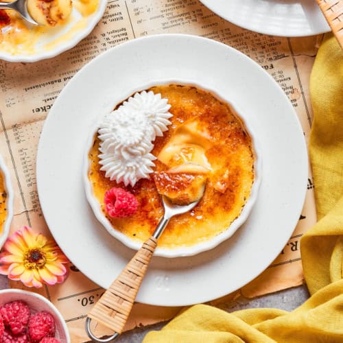 overhead photo of a white ramekin with vanilla creme brulee