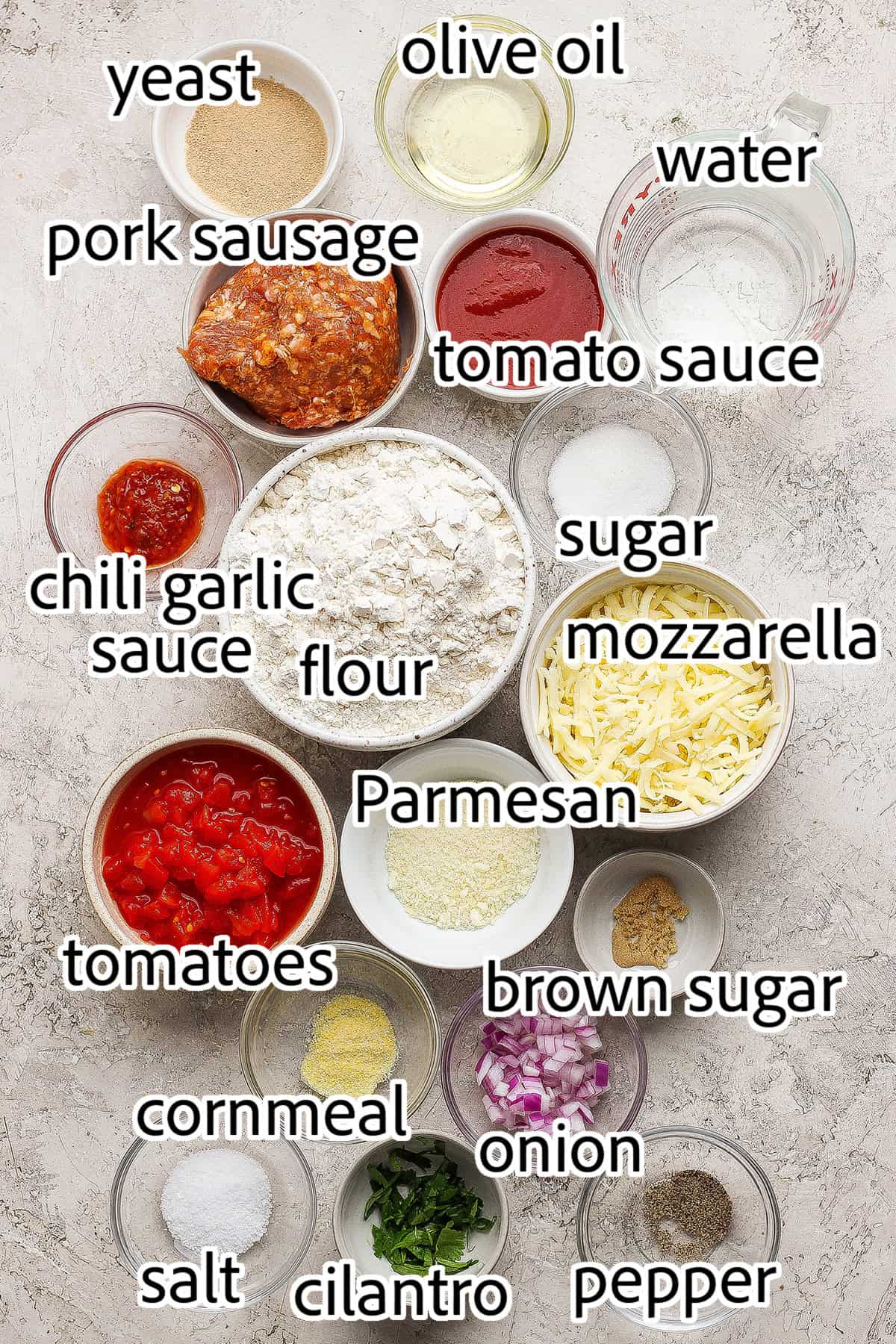 This skillet pizza with sausage has an Asian-inspired twist with chili garlic tomato sauce! A cast iron favorite with a crisp, chewy crust. ingredients needed to make skillet pizza
