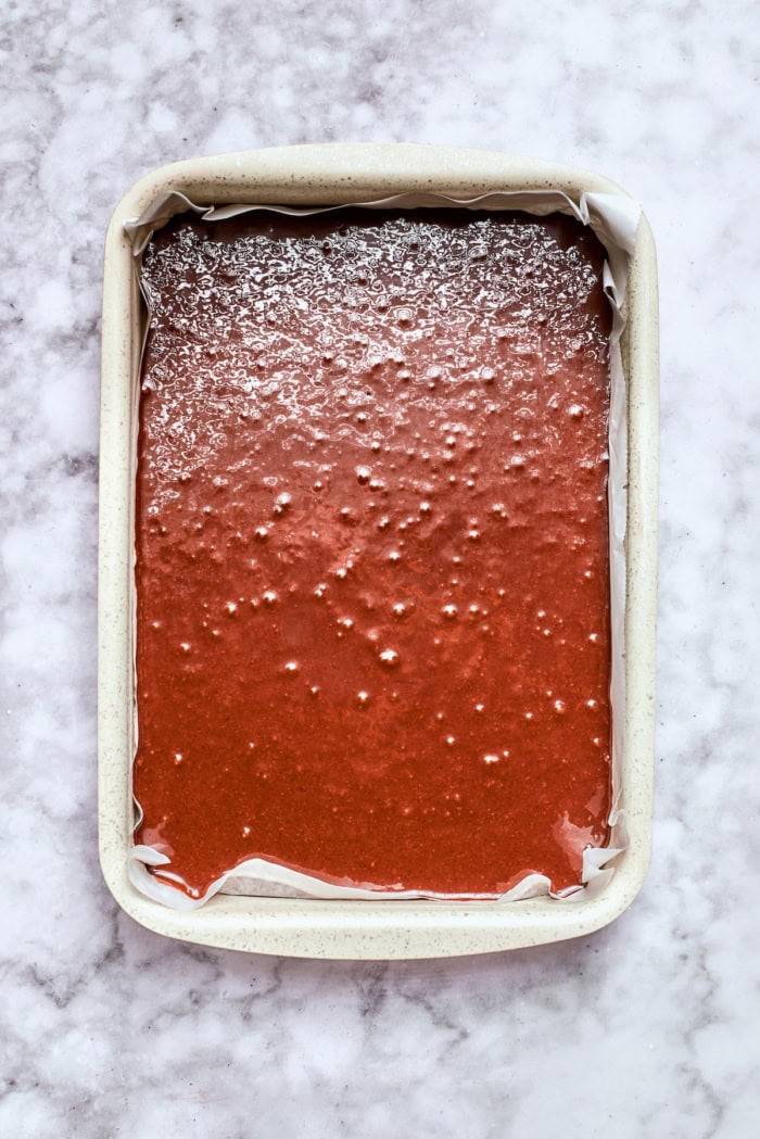 chocolate cake batter in a 9 x 13 pan