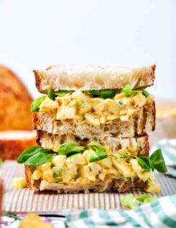 close-up photo of a stack of egg salad sandwiches