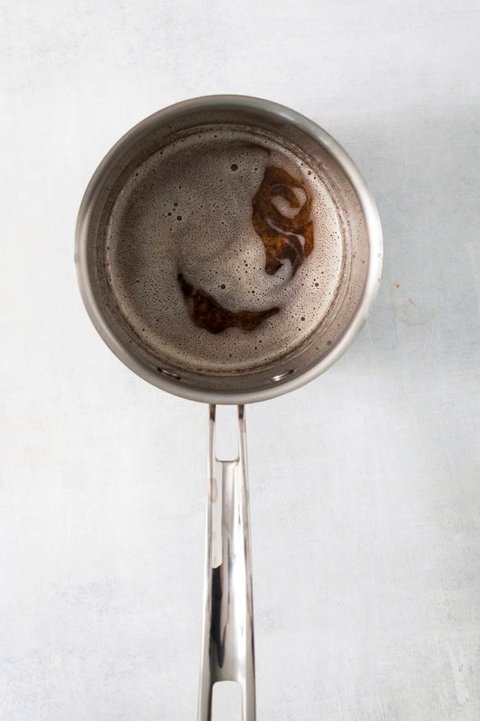 Brown butter in saucepan.