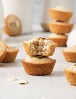 Stack of two financiers, with top one bitten to show tender crumb.