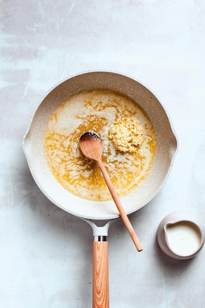 Garlic added to skillet of melted butter.