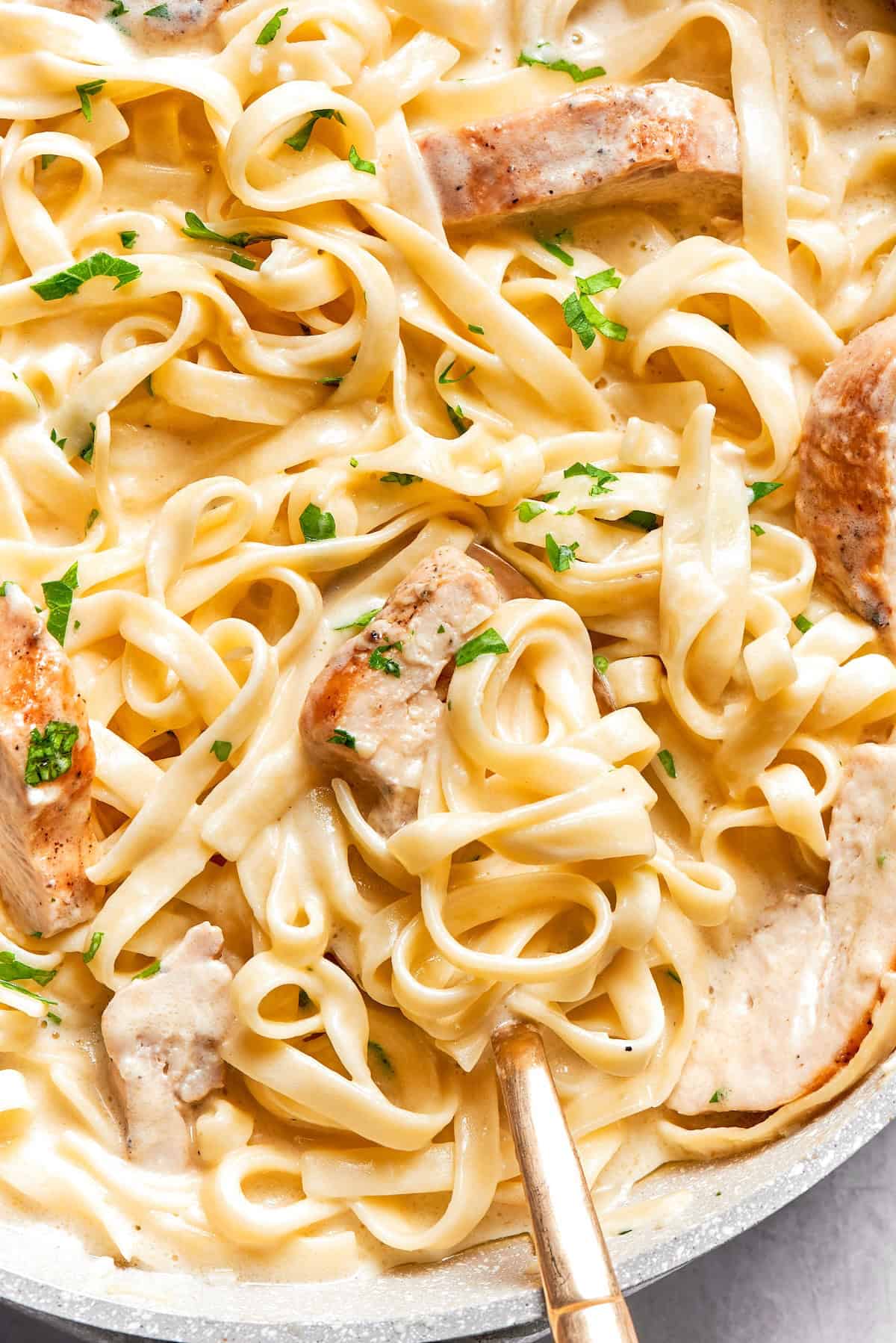Skillet of chicken fettuccine alfredo.
