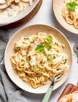 Bowl of fettuccine alfredo with chicken.