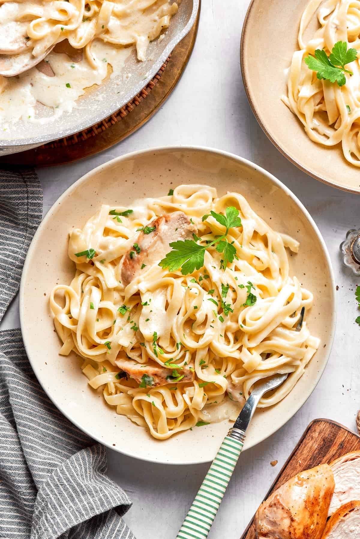 Bowl of fettuccine alfredo with chicken.