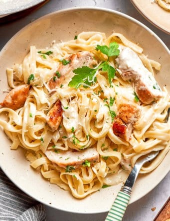overhead photo of a plate of chicken fettuccine Alfredo