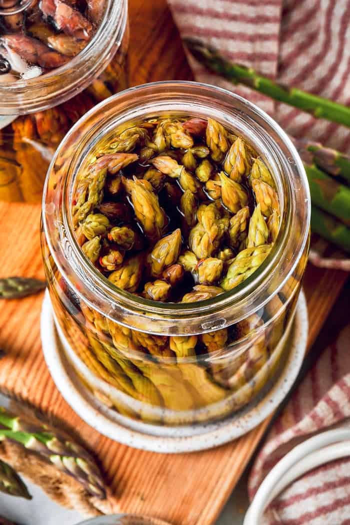 overhead photo of a jar of pickled asparagus spears