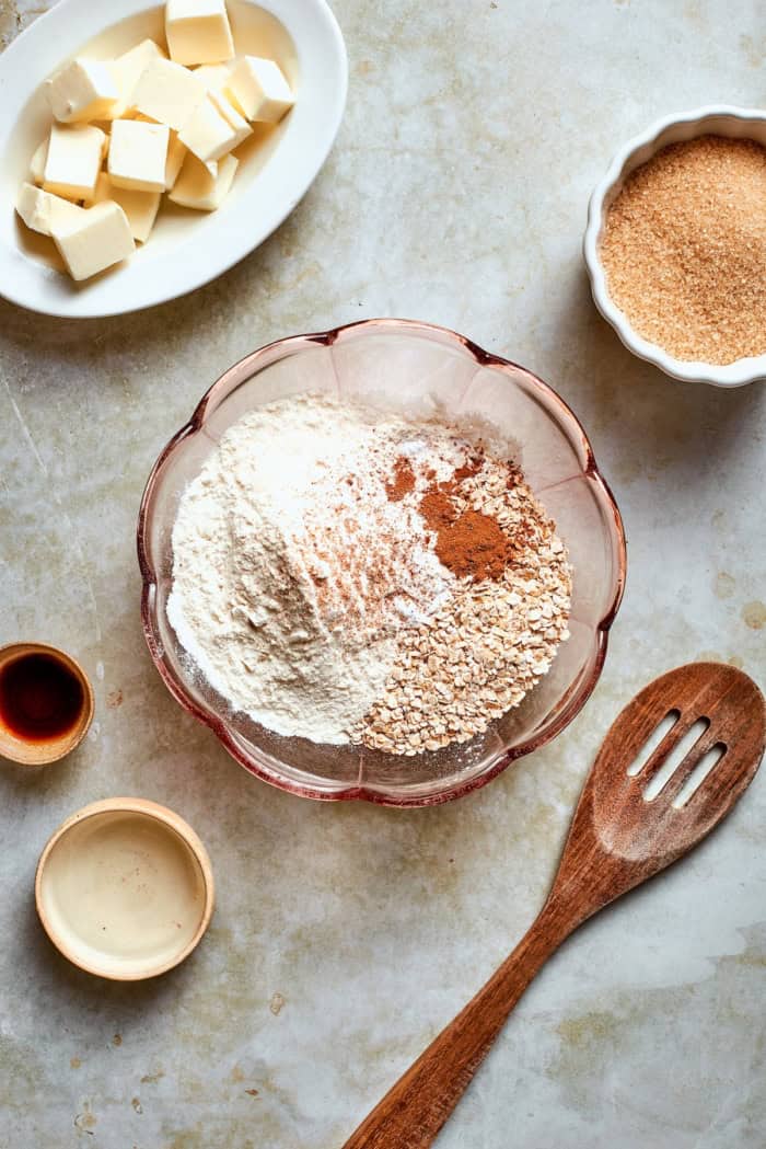 Dry ingredients for oat cookies in mixing bowl.