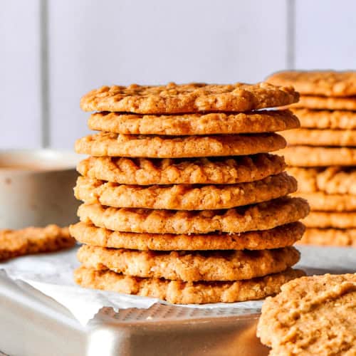 Side photo of a stack of very thin oat cookies