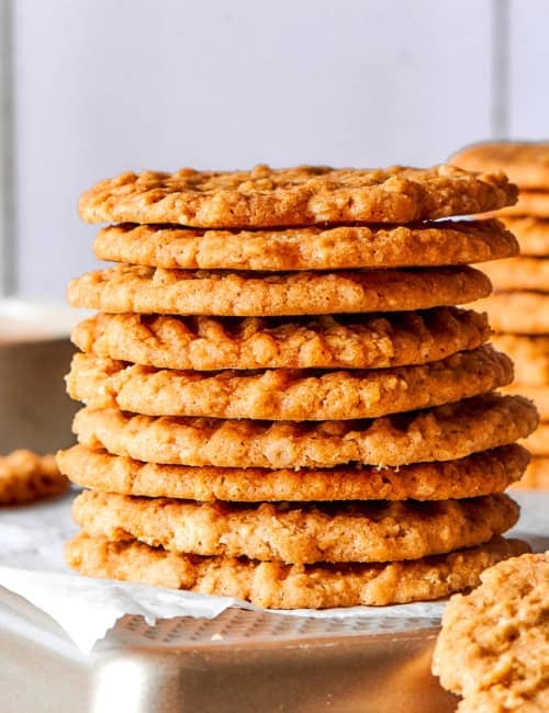 Side photo of a stack of very thin oat cookies