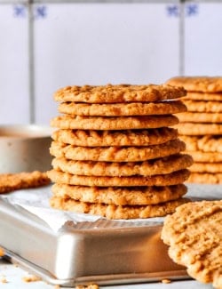 Side photo of a stack of very thin oat cookies