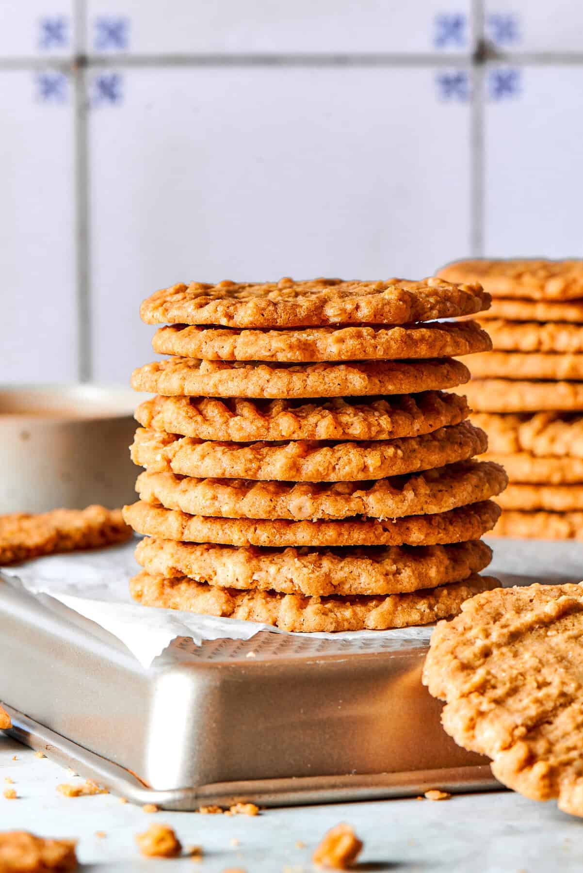 Side photo of a stack of very thin oat cookies