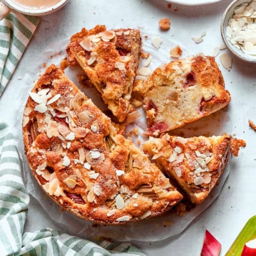 Overhead photo of a Norwegian Rhubarb Cake, sliced