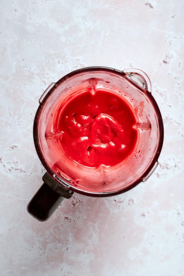This homemade rhubarb ice cream is ultra creamy, with tart rhubarb flavor and a lovely blush-pink color. Such a fun summer dessert! Rhubarb sauce in blender.