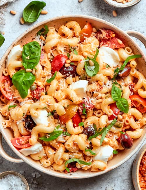 a salad bowl of sun dried tomato pasta salad