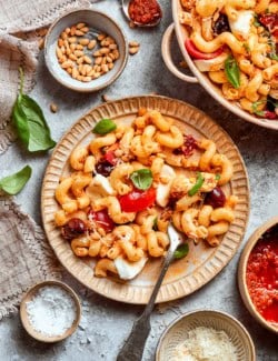 an individual plate of pasta salad with sun dried tomatoes