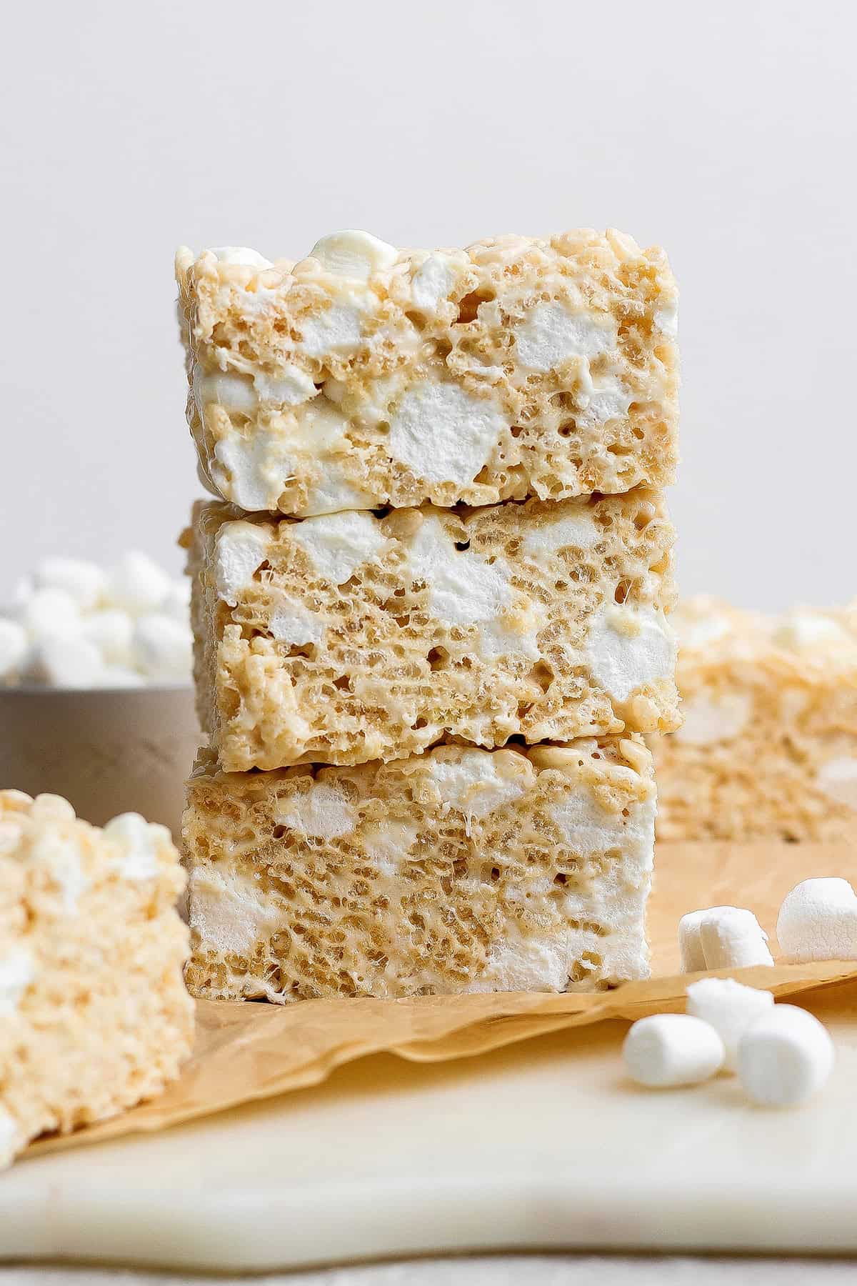 Brown butter Rice Krispie treats are a more indulgent version of the classic, with extra marshmallows, nutty brown butter and flaky sea salt! Stack of 3 brown butter rice krispie treats.