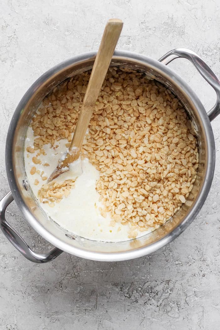 Brown butter Rice Krispie treats are a more indulgent version of the classic, with extra marshmallows, nutty brown butter and flaky sea salt! Rice krispies added to pot of melted marshmallows and butter.