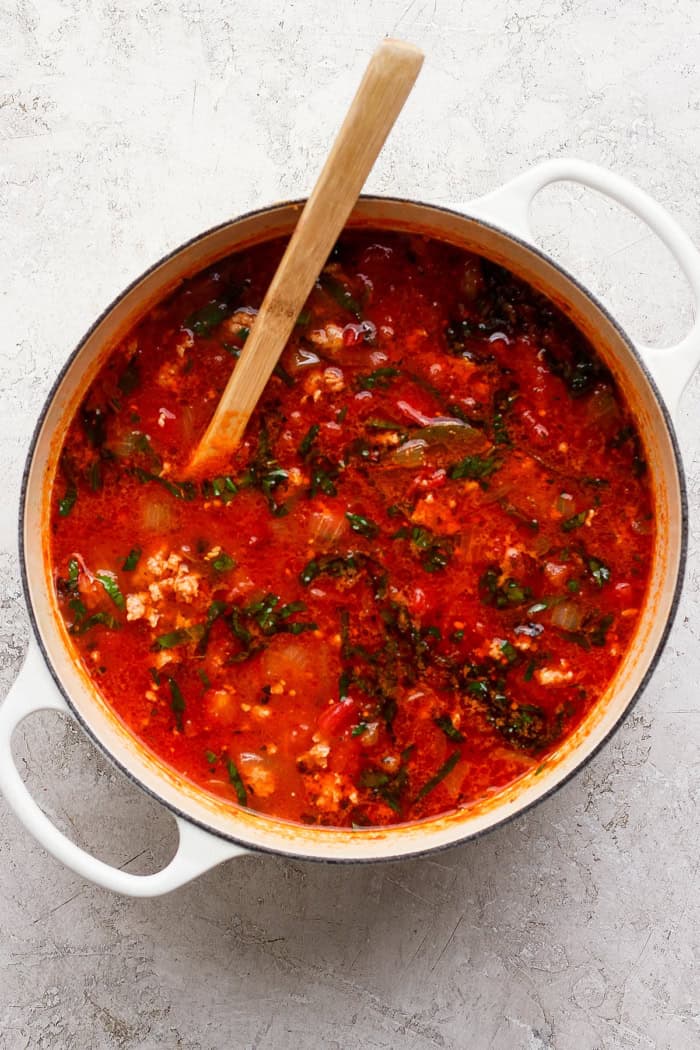 a large white pot of simmering lasagna soup