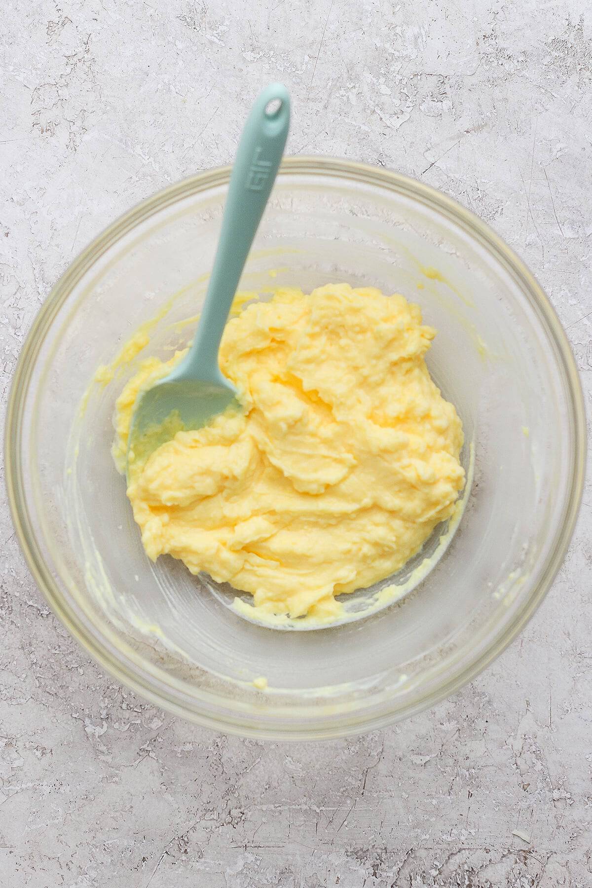 buttermilk and instant vanilla pudding mixed together in a large clear bowl